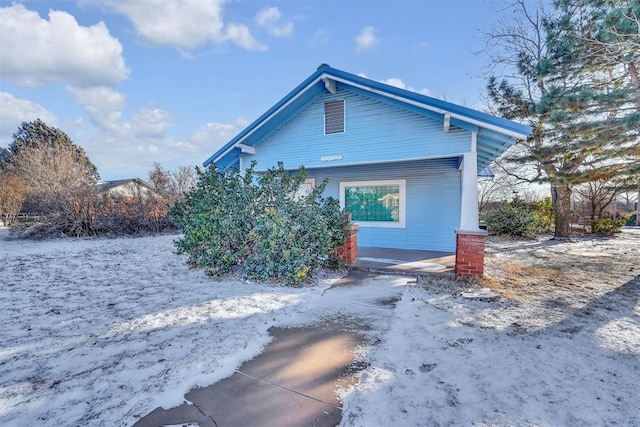 view of snow covered house