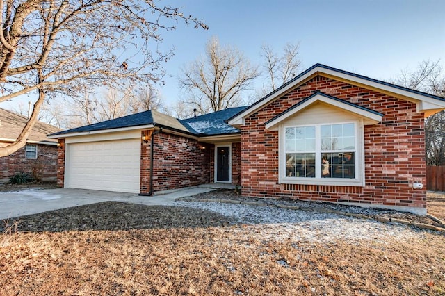 single story home featuring a garage