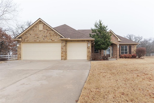 ranch-style home featuring a garage