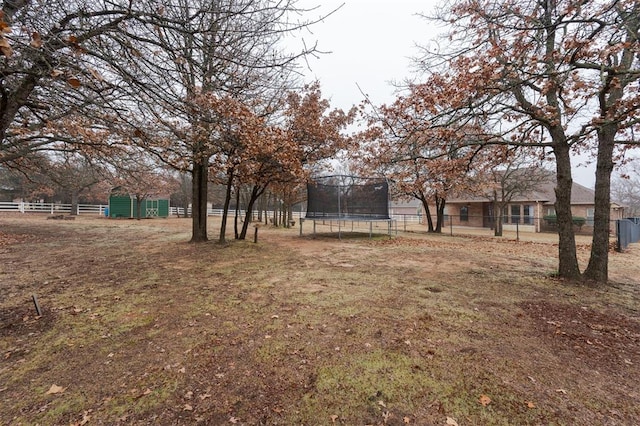 view of yard with a trampoline