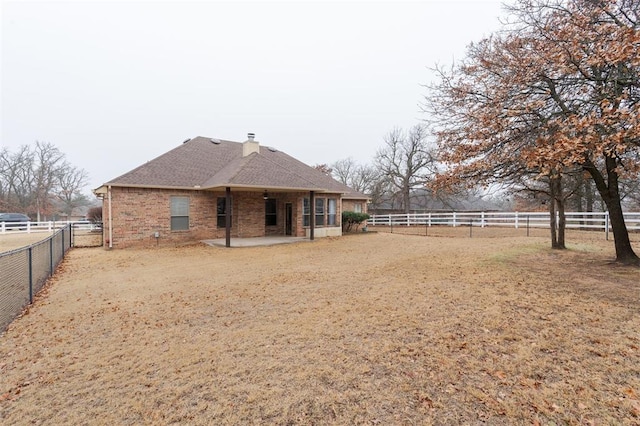 back of house featuring a patio