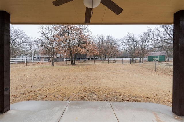 view of yard with ceiling fan