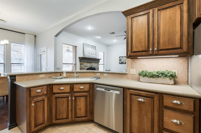 kitchen with sink, backsplash, kitchen peninsula, and dishwasher