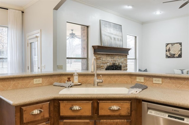 kitchen featuring sink, ornamental molding, dishwasher, and ceiling fan