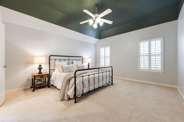 carpeted bedroom featuring vaulted ceiling and ceiling fan