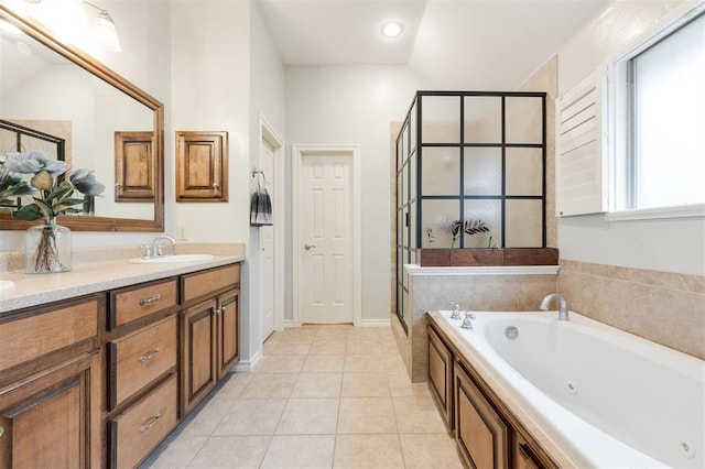 bathroom with vanity, tile patterned floors, and independent shower and bath