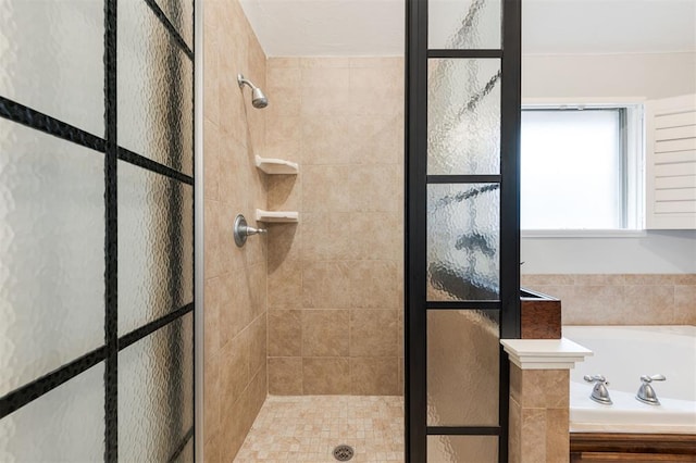 bathroom with independent shower and bath