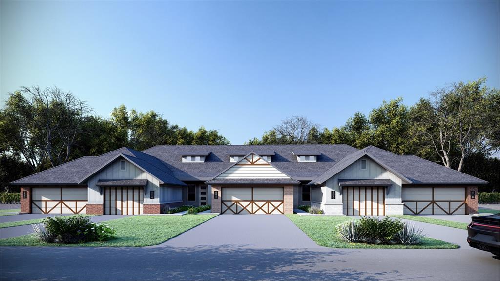 view of front of house with a garage and a front yard