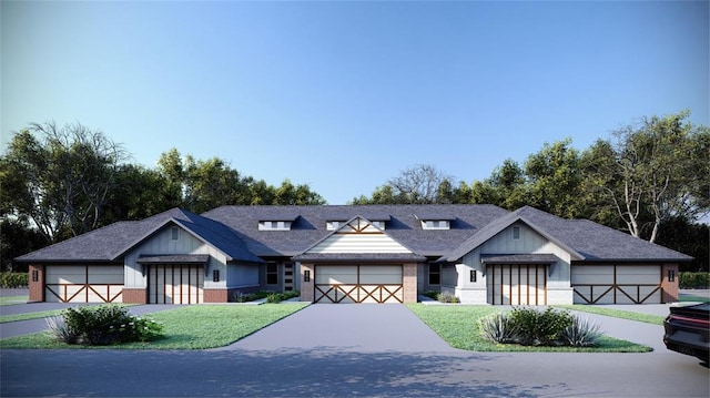 view of front of house with a garage and a front yard