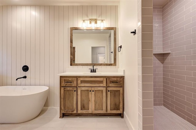 bathroom with vanity and independent shower and bath