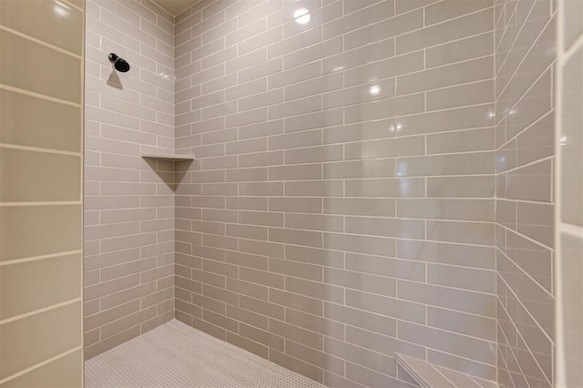 bathroom with tiled shower