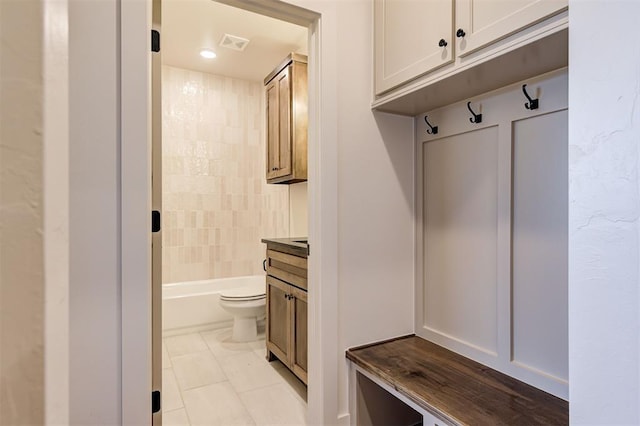 mudroom with light tile patterned flooring