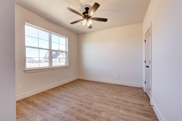 spare room with light hardwood / wood-style floors and ceiling fan