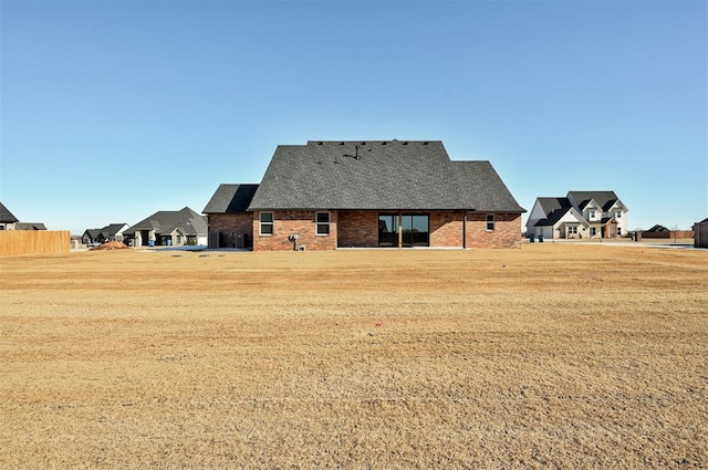 back of house with a yard