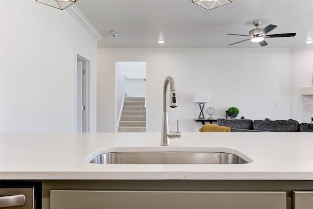 kitchen with ceiling fan, sink, and ornamental molding