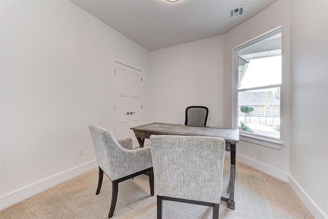 office space with light colored carpet