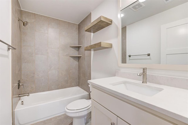 full bathroom with toilet, tiled shower / bath combo, and vanity