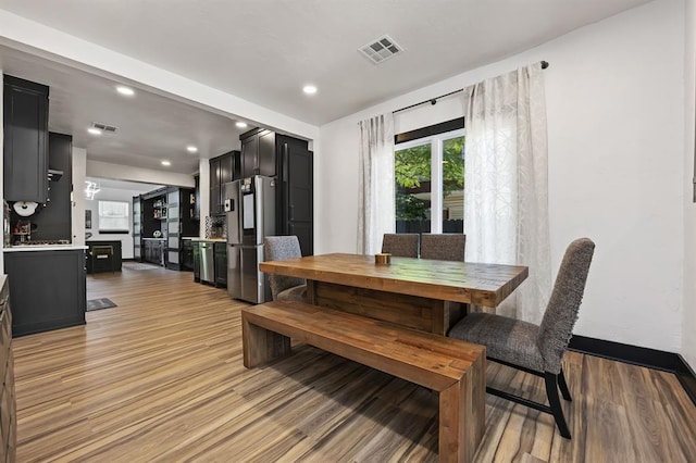 dining area with light hardwood / wood-style flooring