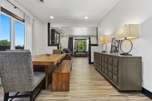 dining area featuring light wood-type flooring