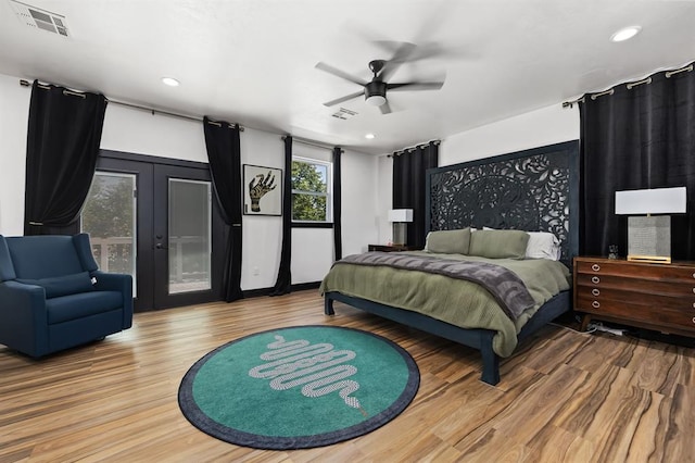 bedroom featuring french doors, ceiling fan, hardwood / wood-style floors, and access to outside