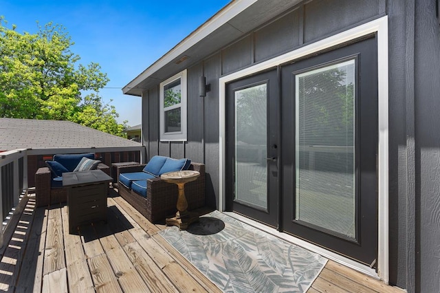 wooden deck with an outdoor hangout area