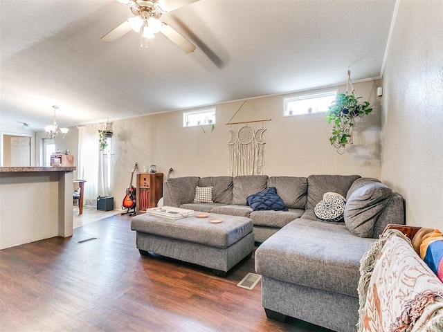 living room with ceiling fan and dark hardwood / wood-style flooring