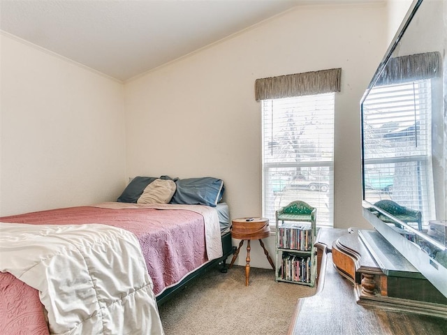 bedroom featuring vaulted ceiling and carpet