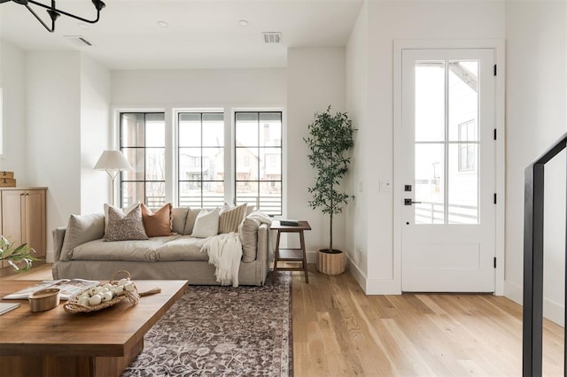 living room with light hardwood / wood-style floors