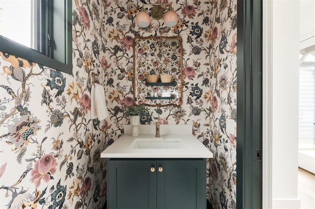 bathroom featuring a healthy amount of sunlight and vanity