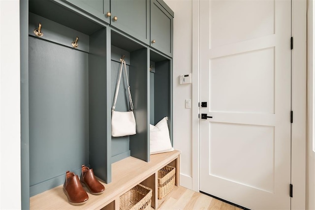 mudroom with light hardwood / wood-style floors