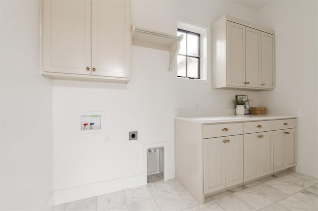 washroom featuring hookup for a washing machine, electric dryer hookup, and cabinets