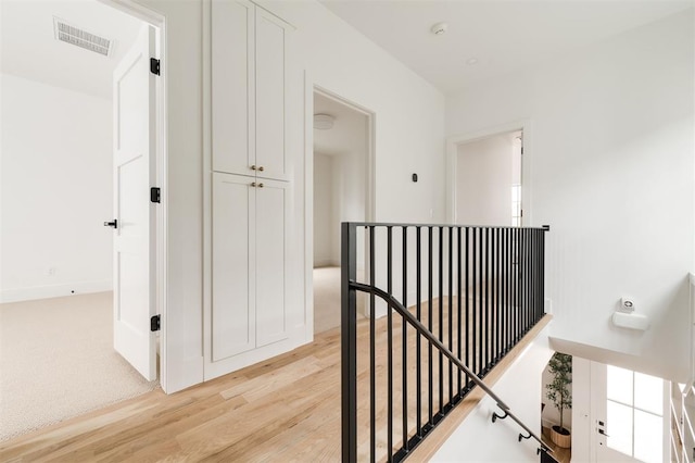 hall with light hardwood / wood-style flooring