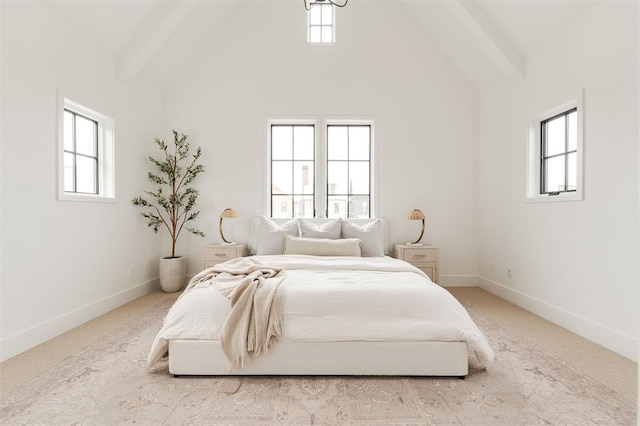 carpeted bedroom featuring high vaulted ceiling and beam ceiling