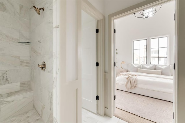 bathroom with tiled shower