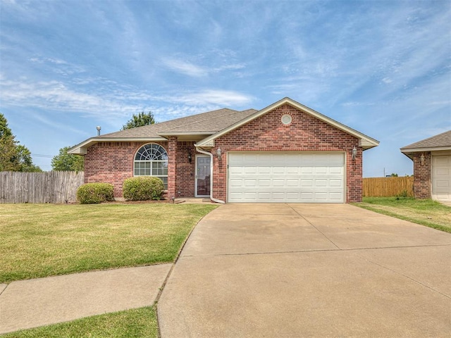 ranch-style house with a front lawn and a garage