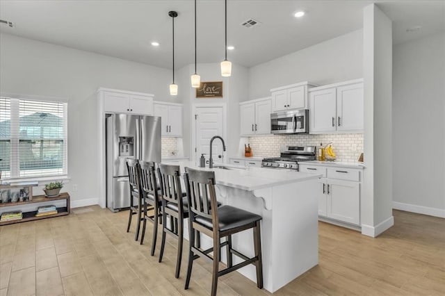 kitchen with white cabinetry, sink, and appliances with stainless steel finishes