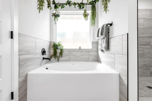 bathroom featuring a tub