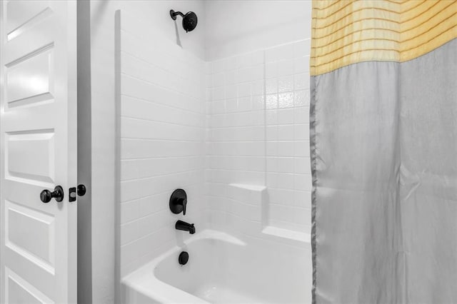 bathroom featuring shower / bathtub combination with curtain