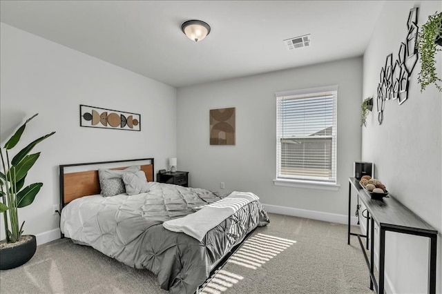 bedroom with light colored carpet