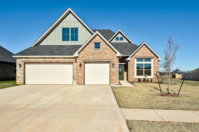 view of front of home featuring a garage and a front lawn