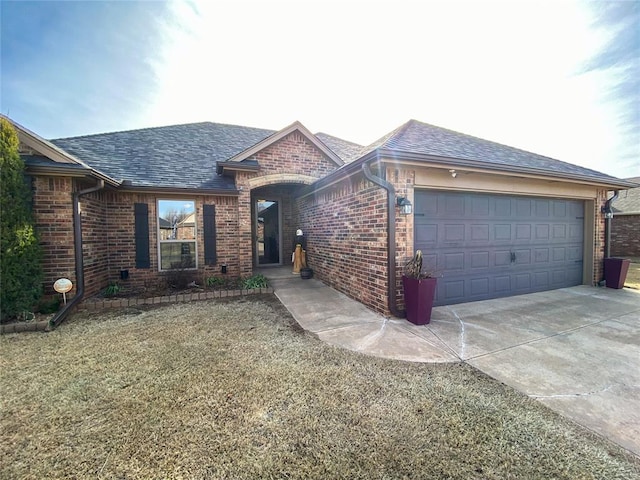 ranch-style house with a garage and a front yard