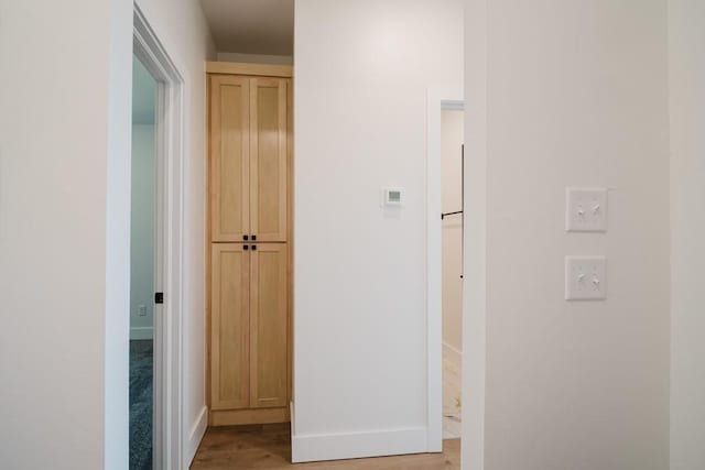 hallway featuring light wood-type flooring