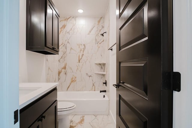 full bathroom with toilet, vanity, and tiled shower / bath