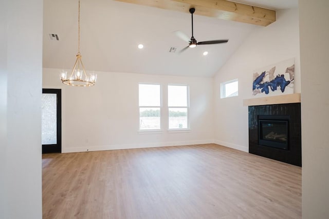 unfurnished living room with ceiling fan with notable chandelier, light hardwood / wood-style floors, beam ceiling, and high vaulted ceiling