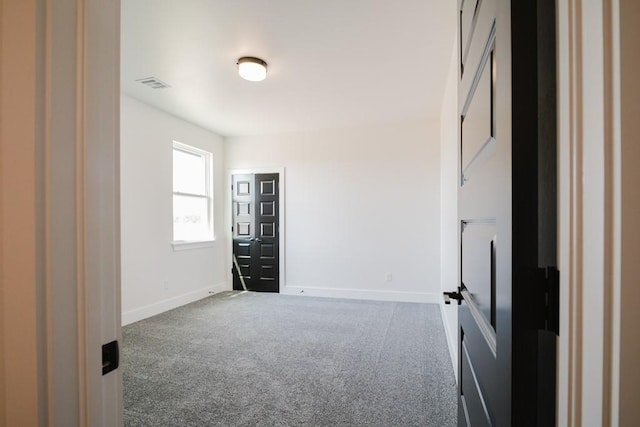 spare room with carpet floors