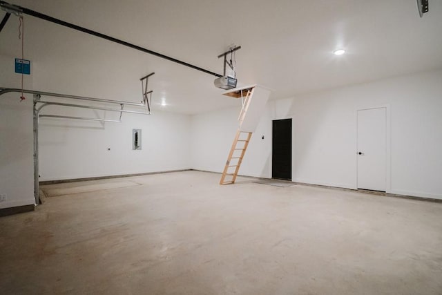 garage featuring a garage door opener and electric panel