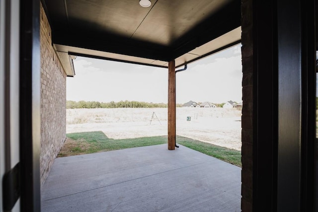 view of patio featuring a water view