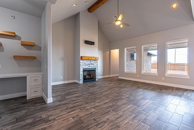 unfurnished living room featuring ceiling fan, beam ceiling, a fireplace, and high vaulted ceiling