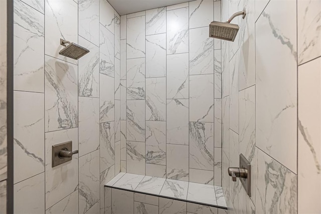 bathroom with tiled shower