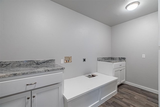 laundry room with cabinets, electric dryer hookup, dark hardwood / wood-style flooring, and hookup for a washing machine